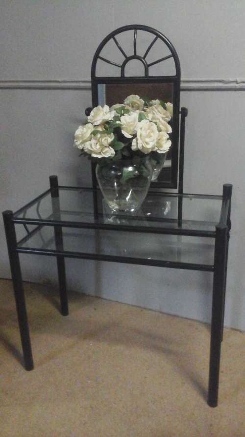 WOW A MAGNIFICENT STEEL AND GLASS DRESSING TABLE. HAS AN OVAL MIRROR WITH AN INTERESTING DESIGN