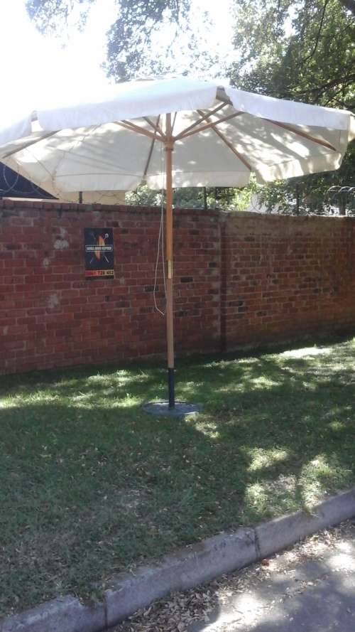 STILL LOTS OF SUMMERTIME LEFT. MAKE USE OF THIS MAGNIFICENT LARGE UMBRELLA TO GUARD AGAINST THE SUN!
