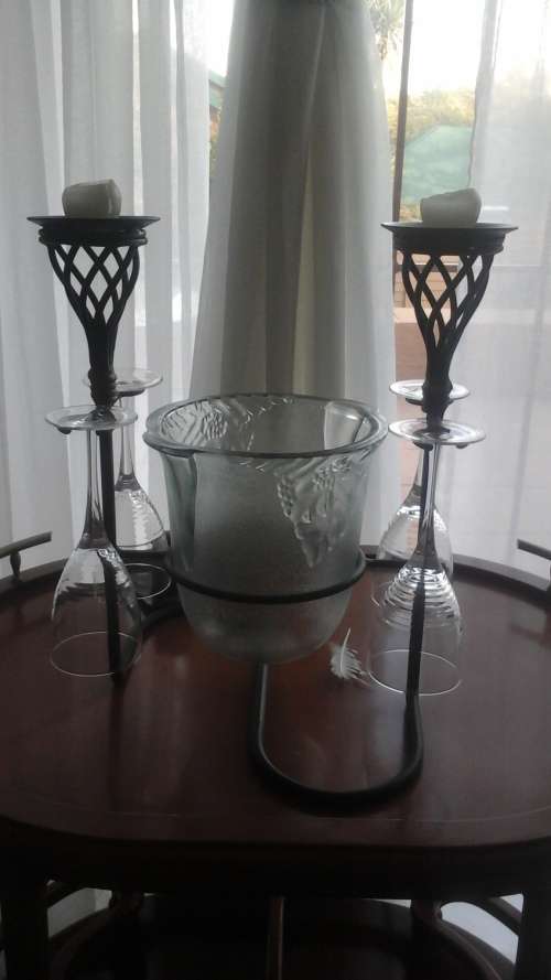 A MAGNIFICENT AND UNUSUAL WROUGHT IRON ICE BUCKET, CANDLE AND GLASS HOLDER COMBINATION