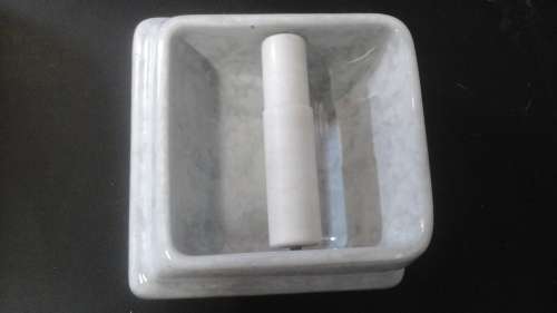 A LOVELY SPECKLED GRAY AND WHITE TOILET ROLL HOLDER.  HAS A SEE THROUGH PLASTIC  SHAFT