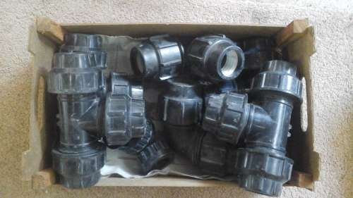 A COLLECTION OF PIPE  FITTINGS. SOME NEW SOME OLD.
