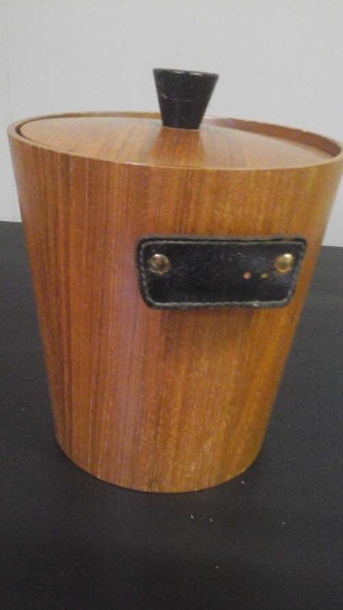 AN AMAZING ART DECO STYLE WOODEN ICE BUCKET WITH A PLASTIC LINING,LEATHER TYPE HANDLES,&PLATED TONGS