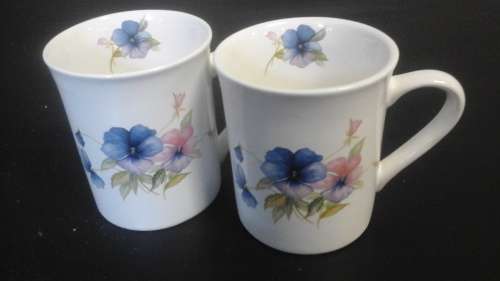 TWO EXQUISITE TAURUS CERAMICS MUG. MADE IN EMPANGENI. MAGNIFICENT PIECE!