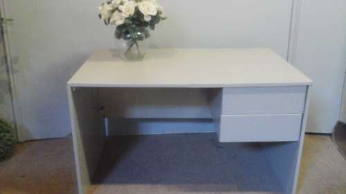 A PRACTICAL AND HANDY WOODEN DESK. PAINTED CREAM. HAS TWO DRAWERS FOR ALL YOUR STATIONERY