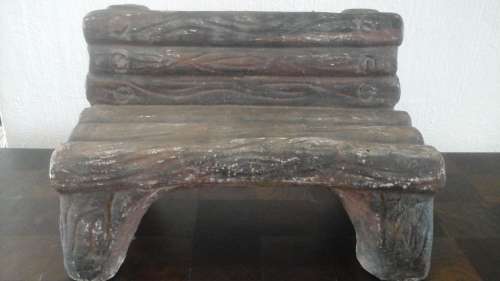 AN ABSOLUTELY CUTE AND COLLECTIBLE MINIATURE CONCRETE GARDEN BENCH. DEFINITLY A MUST HAVE