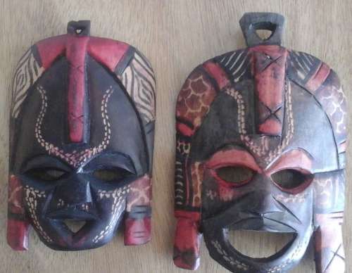 TWO INCREDIBLE CARVED WOODEN TRIBAL MASKS. STUNNING DECORATIVE AND COLLECTIBLE SET!