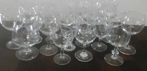 AN AMAZING SELECTION OF APPROXIMATELY 17 VINTAGE GLASSES. ALL SHAPES AND SIZES