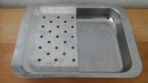 HANDY FOR YOUR HOME BAR AND ICE TRAY AND STRAINER COMBINED. MADE FROM STAINLESS STEEL
