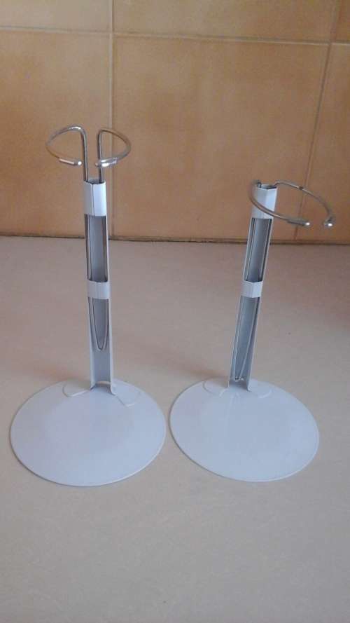 TWO HANDY AND PRACTICAL VINTAGE STANDS FOR PORCELAIN DOLLS. STAND THEM UP TO LOOK PRETTY