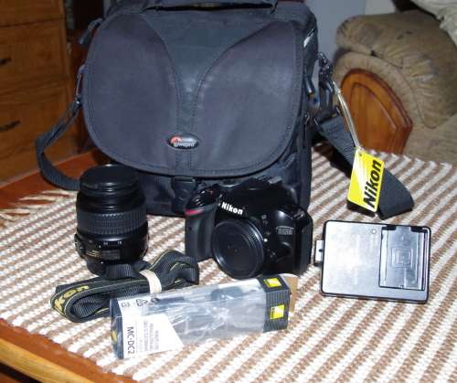 Nikon D3200 with 18-55 lens, bag and remote cable, photos show exact item on sale.