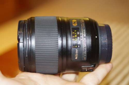 Nikon 60mm 2.8. this lens has signs of use as shown itn the photos, works 100%,