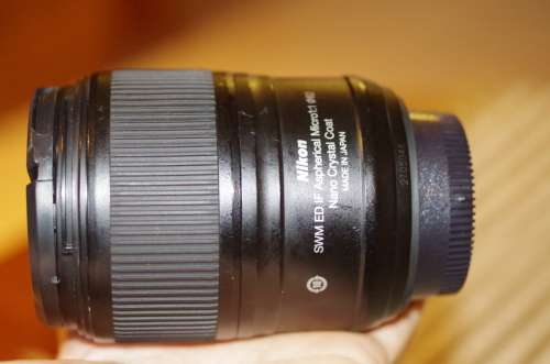 Nikon 60mm 2.8. this lens has signs of use as shown itn the photos, works 100%,