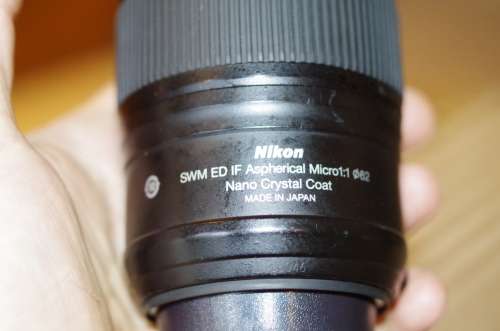 Nikon 60mm 2.8. this lens has signs of use as shown itn the photos, works 100%,