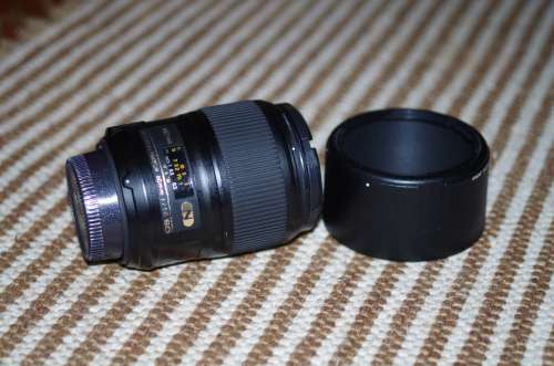 Nikon 60mm 2.8. this lens has signs of use as shown itn the photos, works 100%,