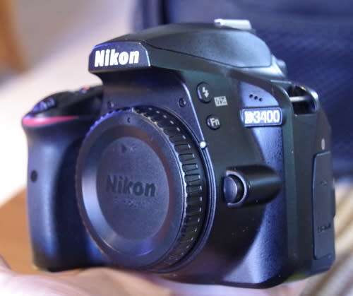 Nikon D3400 with 18-55 VR ii lens, photos show exact kit on sale.
