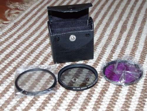 set of 3 58 mm Filters with a case, spotless like new. photos show exact items on sale