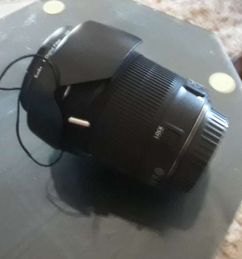 Canon 18-135 STM lens, photos show exatc item an  sale, like new inside and out.