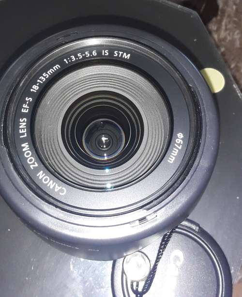 Canon 18-135 STM lens, photos show exatc item an  sale, like new inside and out.