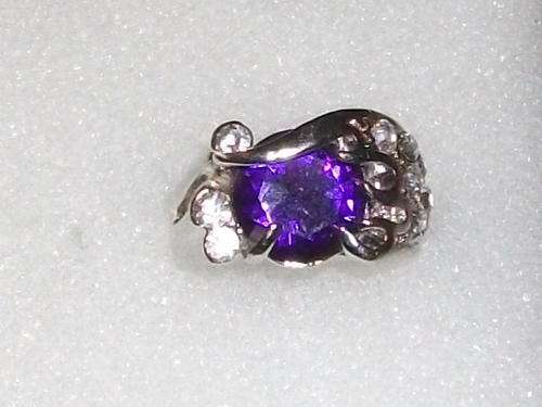 STUNNIG SILVER DESIGNERS ELECTROPLATED RING WITH A BEAUTIFUL BLUE STONE AND SIM DIAMONDS SIZE 17