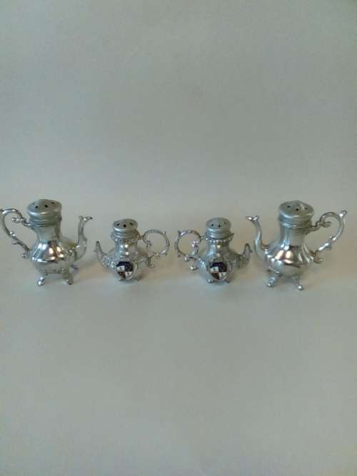 FOUR COLLECTABLE SALT AND PEPPER ITEMS (silver/metal)