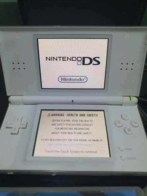 NINTENDO  DS LITE..ND TWO GAMES...HAND HELD