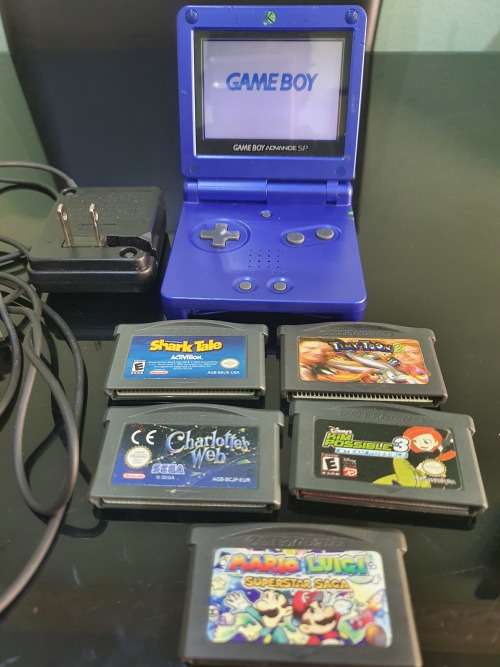 NINTENDO GAMEBOY ADVANCE SP WITH 5 CARTRIDGES..WORKING ORDER