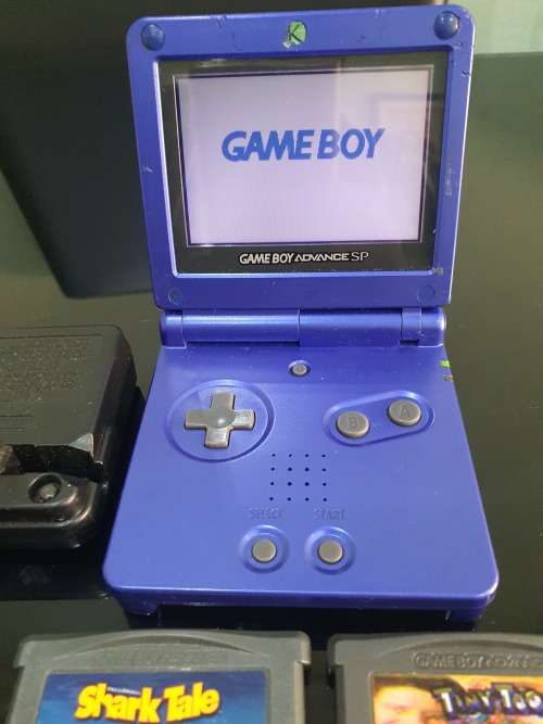 NINTENDO GAMEBOY ADVANCE SP WITH 5 CARTRIDGES..WORKING ORDER