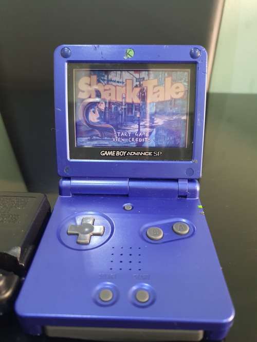 NINTENDO GAMEBOY ADVANCE SP WITH 5 CARTRIDGES..WORKING ORDER