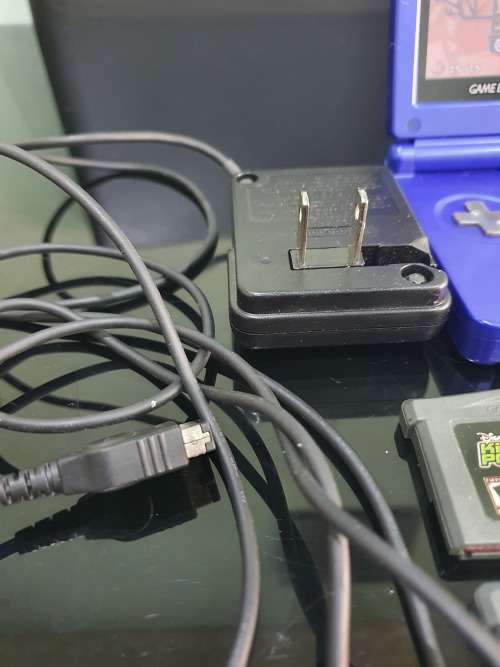 NINTENDO GAMEBOY ADVANCE SP WITH 5 CARTRIDGES..WORKING ORDER