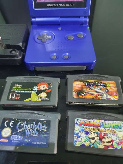 NINTENDO GAMEBOY ADVANCE SP WITH 5 CARTRIDGES..WORKING ORDER