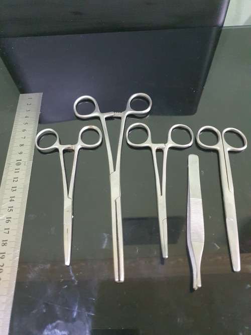 FOUR SERGICAL SCISSORS AND ONE TWEEZER...ALL FOR ONE BID