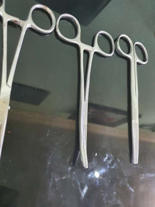 FOUR SERGICAL SCISSORS AND ONE TWEEZER...ALL FOR ONE BID