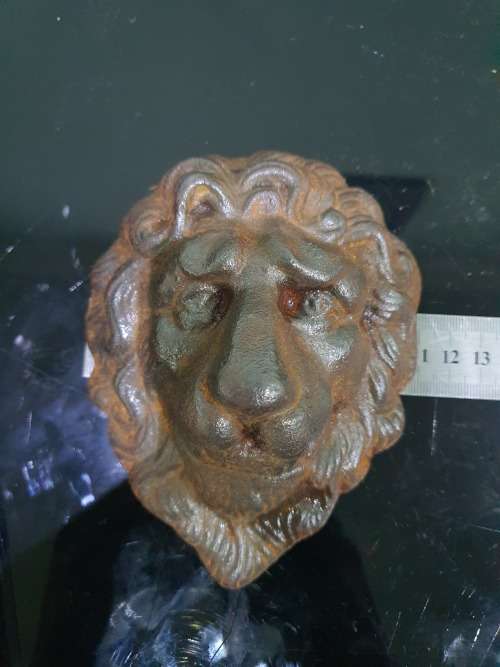 TWO SOLID CAST IRON LION HEADS....HEAVY METAL