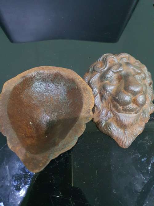 TWO SOLID CAST IRON LION HEADS....HEAVY METAL