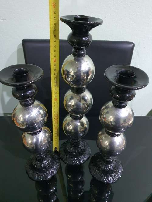 THREE STUNNING DESIGNER CANDLE HOLDERS WITH SOLID CAST IRON STAND