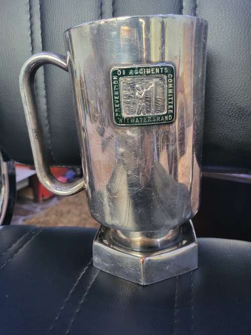 SILVER PLATED COMMEMORATIVE MINING MUG OF WITWATERS RAND (HAS MARKINGS)