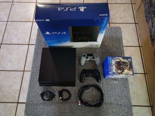 Sony Playstation 4 With 2 Remotes And 9 Games