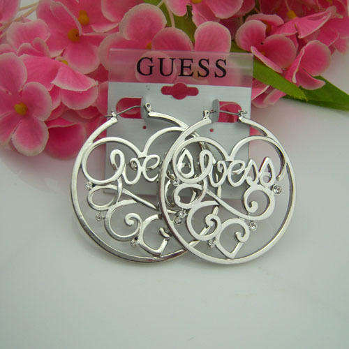 Brand new GUESS boutique earrings.