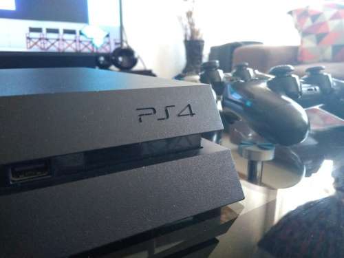 1TB PS4 CONSOLE WITH TWO CONTROLLERS AND TWO GAMES
