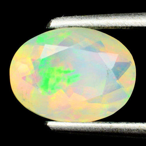 MESMERIZING! MULTI- COLOUR FIRE OPAL 1.14ct ( COLOUR PLAY UNDER DIFFERENT LIGHTS)