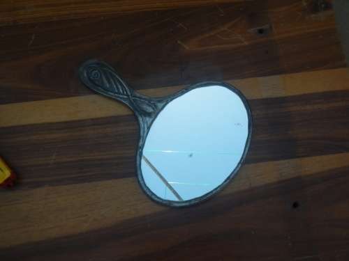 Antique pewter hand mirror