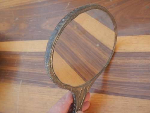 Antique pewter hand mirror