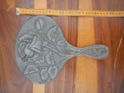 Antique pewter hand mirror