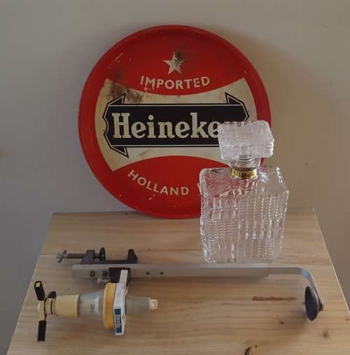 Decanter, vintage Heineken tray and optics