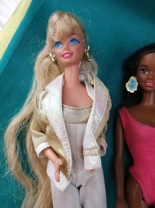 Three Barbie Dolls