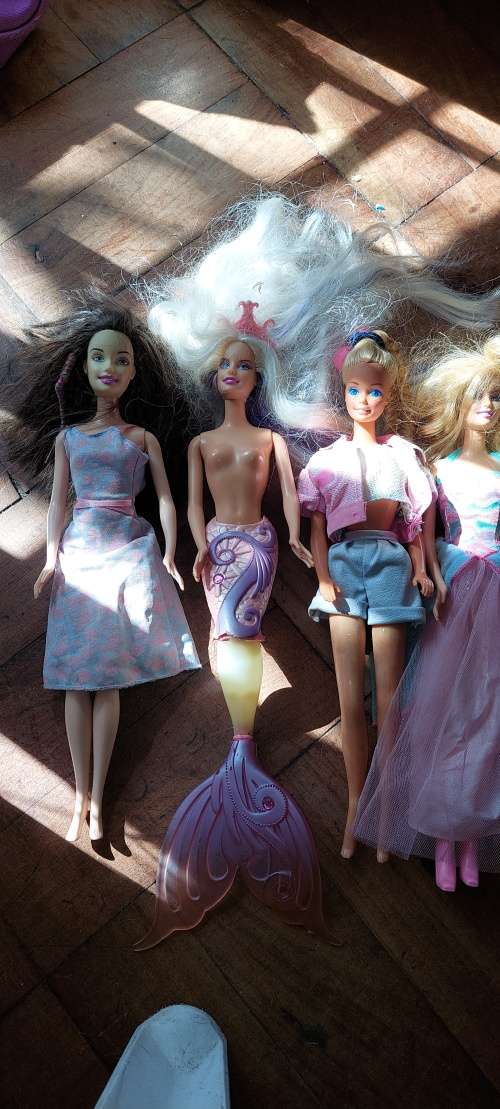7 X Barbies (1966-2002) with bag of clothes and accessories