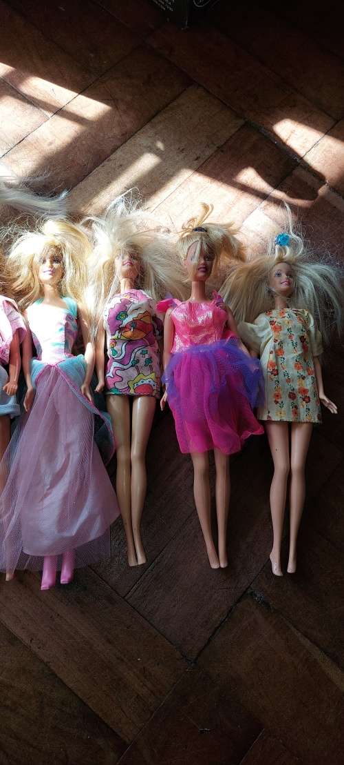 7 X Barbies (1966-2002) with bag of clothes and accessories