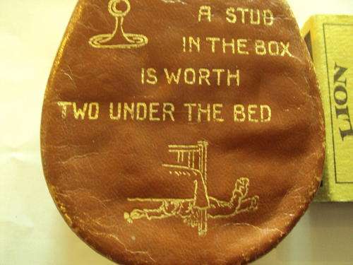 Leather box with "A stud in the box is worth two under the bed" on it