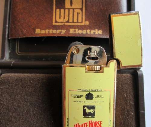 WIM BATTER ELECTRIC CASE AND WHITE HORSE LIGHTER 33