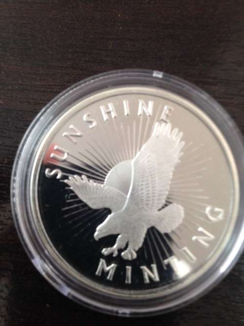 ONE TROY 1oz   SUNSHINE ROUND    IN  999.9%  PURE SOLID SILVER